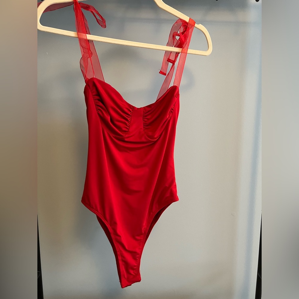 Bright red bodysuit